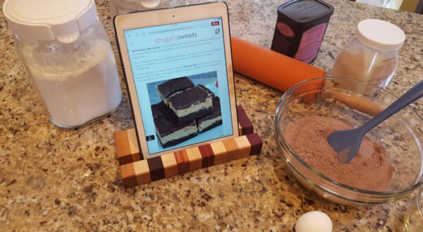 wooden tablet stand with cook book on ipad