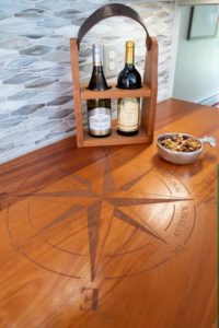 Compass laser engraved on a wood countertop