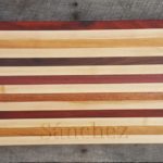 big striped board with engraving on bottom